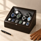 6-watch winder box closed, beside a fountain pen and leather gloves