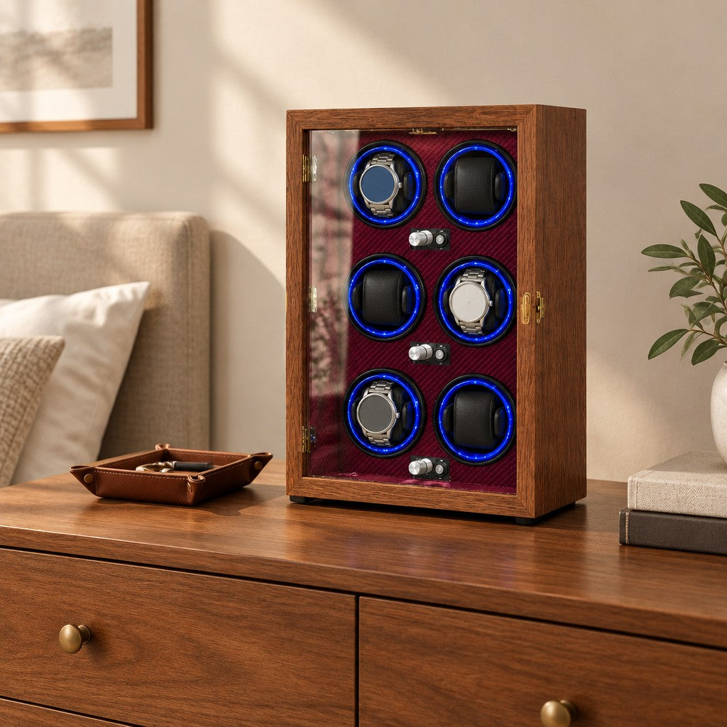 6-watch winder cabinet on a wooden dresser beside a valet tray and books