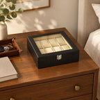 8-slot croc-texture watch box on a wooden chest of drawers, beside a leather tray and a book, for scale