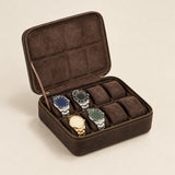 8-slot vintage brown leather watch box, open with four watches