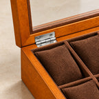 Close-up of the wood finish and silver-tone clasp of the 8-slot watch box