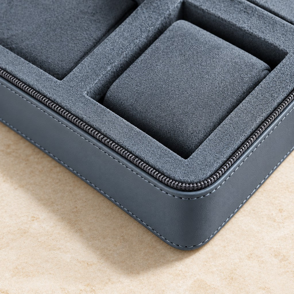Close-up of the zipper, stitching and padded compartments of the leather watch box