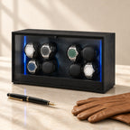 8-watch winder cabinet closed, beside a fountain pen and leather gloves