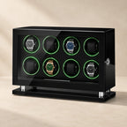 Gloss-black 8-watch winder cabinet with green LED rings and four watches
