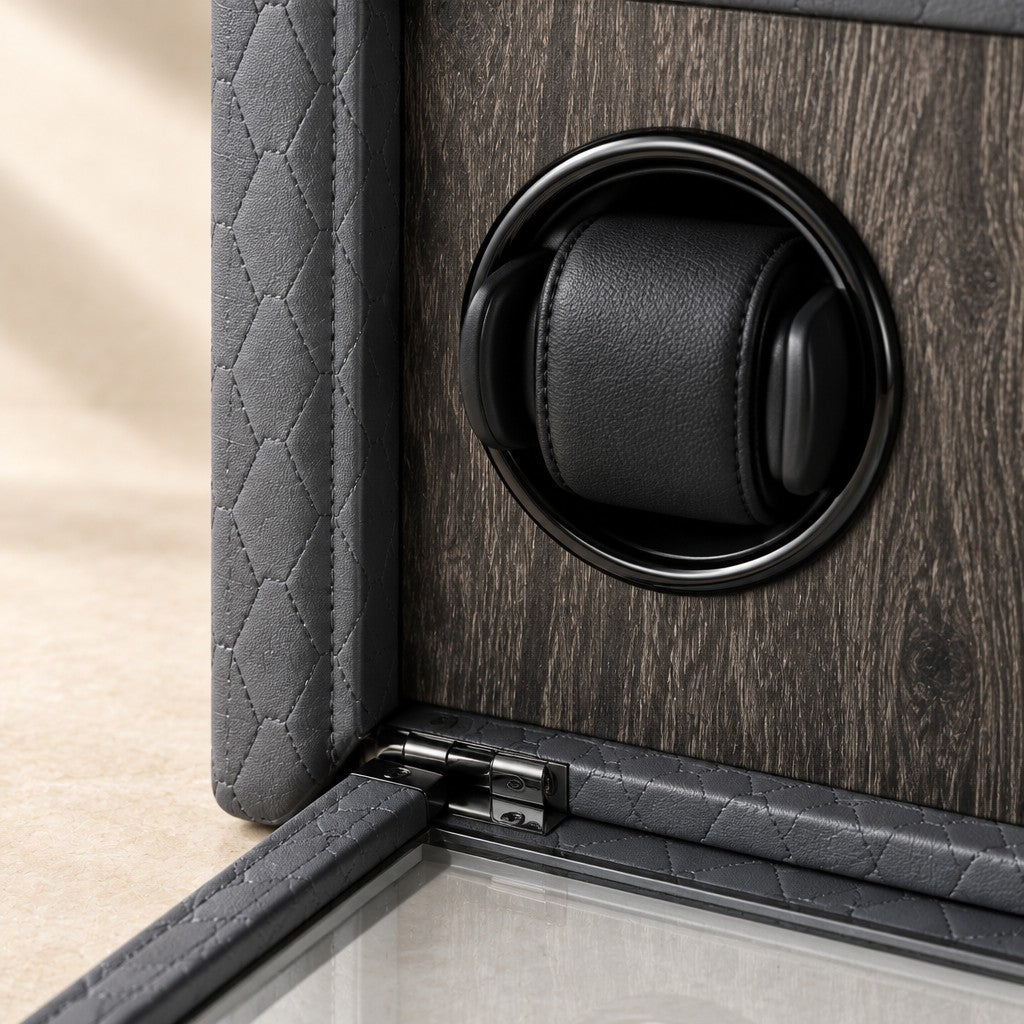 Close-up of a cushioned winding cup on the wood interior and the glass front hinge