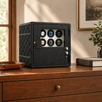 9-watch winder safe on a wooden chest of drawers beside a valet tray and a book