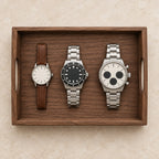 Black walnut valet tray with handles, from above, with watches of different sizes