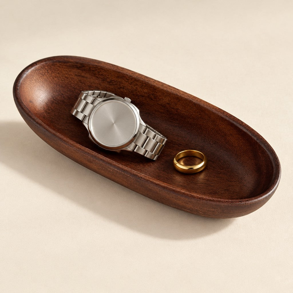 Carved walnut oval valet tray, three-quarter view