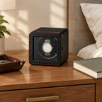 Compact single watch winder on a wooden chest of drawers