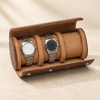 Brown croco-embossed watch roll open with two watches on its pillows