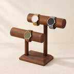 Double T-bar walnut-tone watch stand with three watches