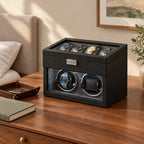 Two-tier watch winder box on a wooden chest of drawers