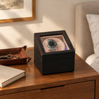Compact double watch winder on a wooden chest of drawers