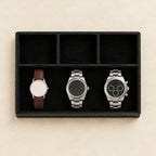 Faux leather desk valet tray with 4 compartments, from above, with watches of different sizes