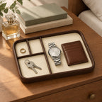 Faux leather valet tray with 4 compartments, on a chest of drawers, for scale