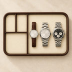 Faux leather valet tray with 4 compartments, from above, with watches of different sizes