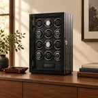 12-watch winder cabinet on a wooden sideboard beside a valet tray and books