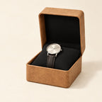 Flip-top single watch box in tan with a black interior, open with one watch