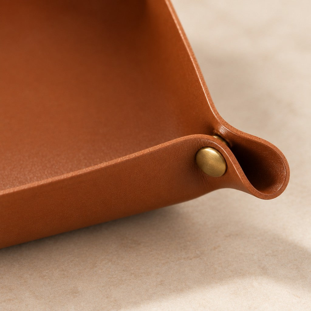 Close-up of a folded corner tab and its brass snap stud