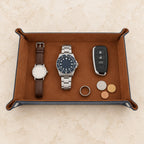 Foldable valet tray with watches of different sizes