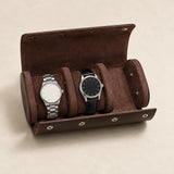Dark brown genuine leather watch roll open with two watches on its pillows