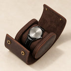 Brown genuine leather single watch roll open, with a watch on its pillow