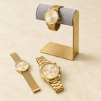 Gold-tone L-frame stand with watches of different sizes