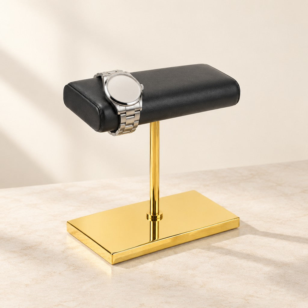 Gold-tone double watch stand with a black leather pillow