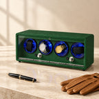 Green 4-watch winder closed, beside a fountain pen and leather gloves