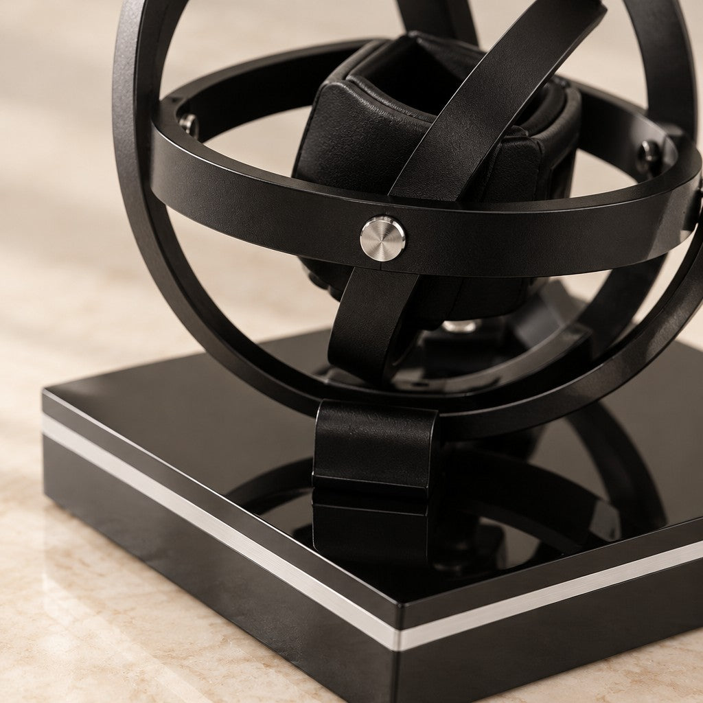 Close-up of the watch holder, a silver pivot screw and the gloss black base