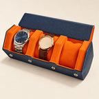 Hexagonal 3-slot watch case in navy with orange interior, three-quarter view