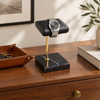 Marble base watch stand on a chest of drawers, for scale