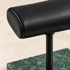 Close-up of the wide leather pillow and the stem on green marble