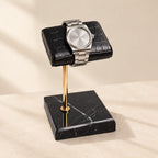 Croc-texture pillow watch stand, black marble and gold stem