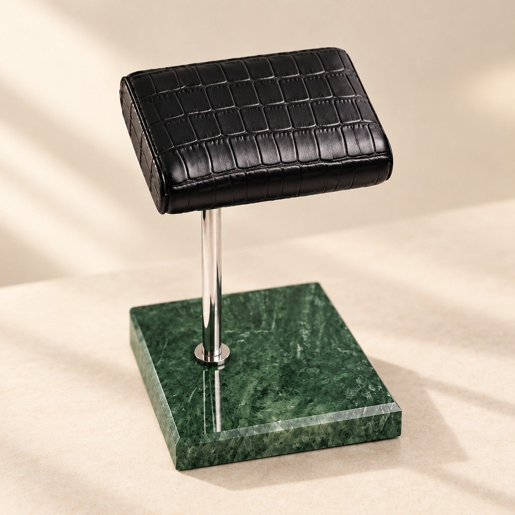 Close-up of the marble watch stand with croc-texture pillow materials and finish