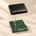 Close-up of the marble watch stand with croc-texture pillow materials and finish