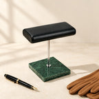 Marble Base Double Watch Stand with Gold or Silver Stem beside a fountain pen and leather gloves