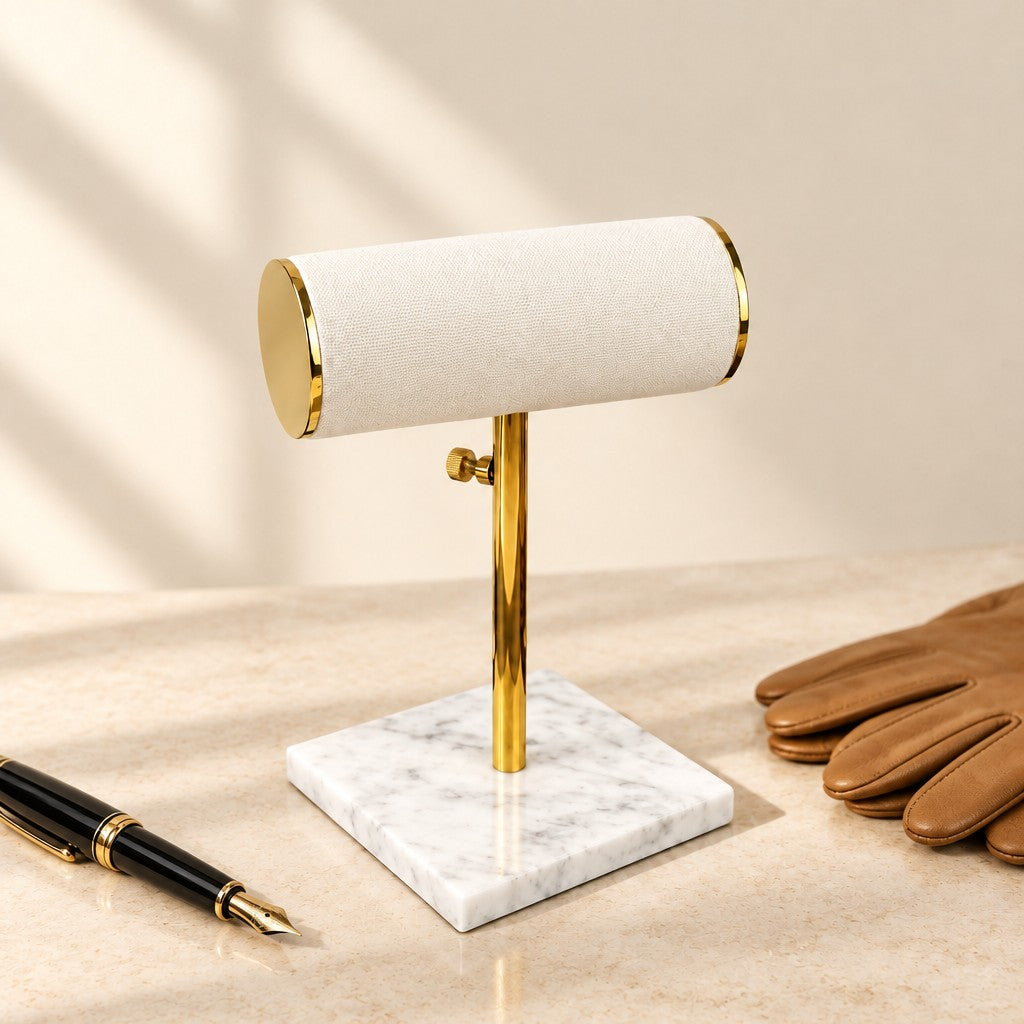 Marble Base T-Bar Watch Stand for 2 Watches beside a fountain pen and leather gloves