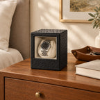 Mini single watch winder on a wooden chest of drawers