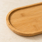 Close-up of the bamboo strips and low rim of the oval tray