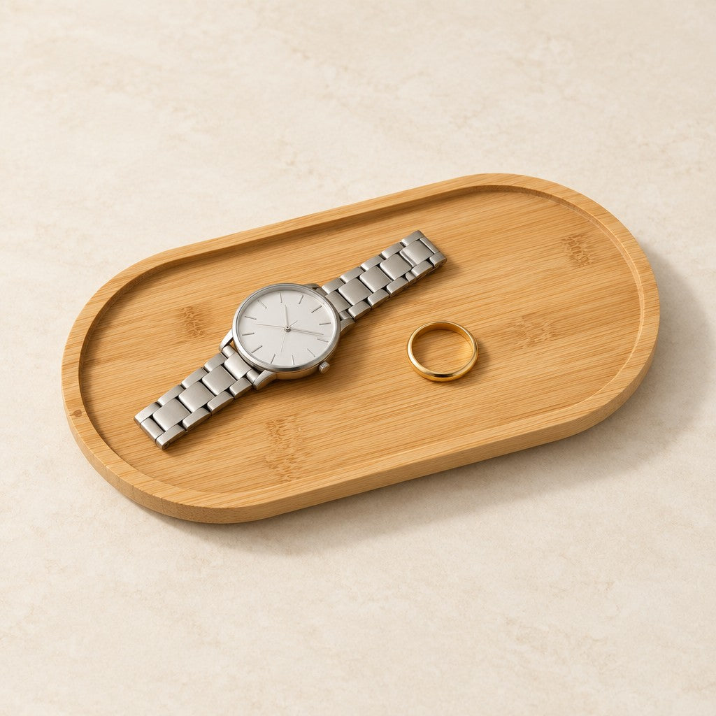 Oval bamboo valet tray holding a watch and a ring