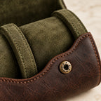 Close-up of the olive lining, a padded pillow and a bronze-tone snap stud