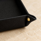 Close-up of the pebbled leather valet tray materials and finish