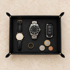 Pebbled leather valet tray with watches of different sizes