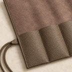 Close-up of the cowhide pockets and tie cord