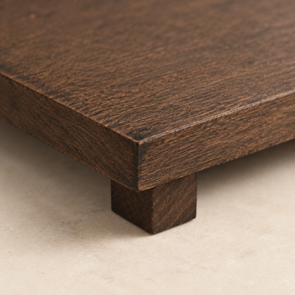 Close-up of the weathered wood grain and block foot of the riser