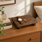 Rustic wooden valet riser on a chest of drawers, for scale