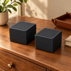 Two single-watch gift boxes on a wooden chest of drawers