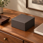 Single watch presentation box on a wooden chest of drawers