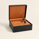 Single watch presentation box in black, open with a watch on its pillow